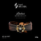 Single Diamond Studded Floral Charm On A Sterling Silver Brown Mesh Cuff Bracelet